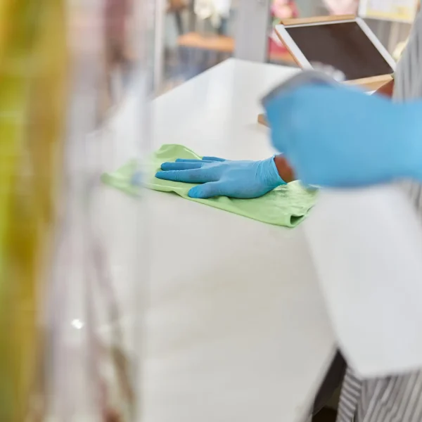 shop-assistant-cleaning-surfaces-with-sanitizer-at-2025-03-06-15-58-36-utc-min.jpg